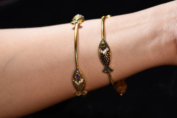 istock Fancy gold looking imitation bangles / bracelets on the woman's wrist 851699654