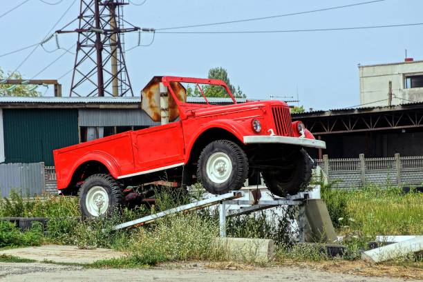 istock red old car on a pedestal 851700304