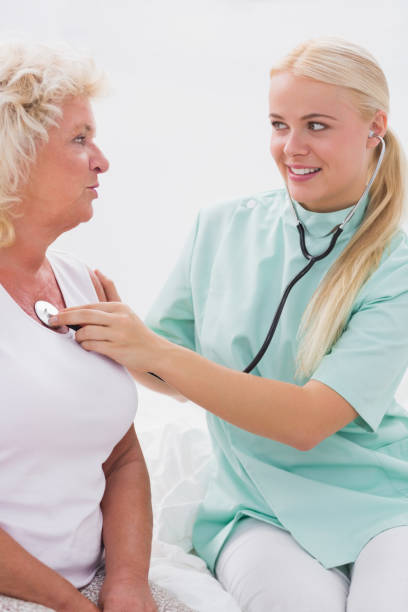 istock Home nurse and patient talking 851709762