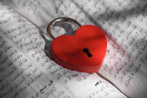 istock An ancient Koran With a heart shaped lock 851714018