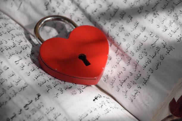 istock An ancient Koran With a heart shaped lock 851714046