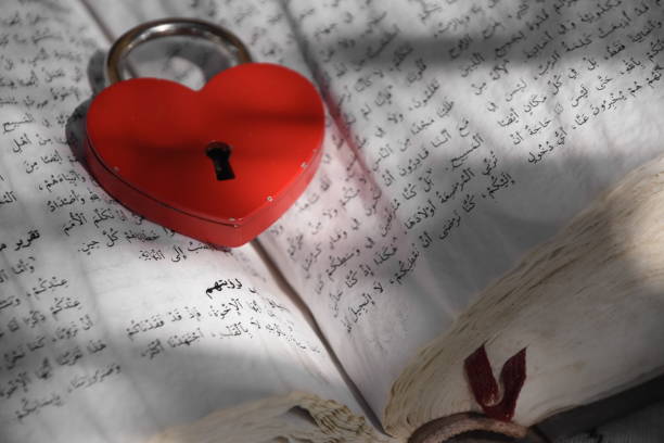 istock An ancient Koran With a heart shaped lock 851716604