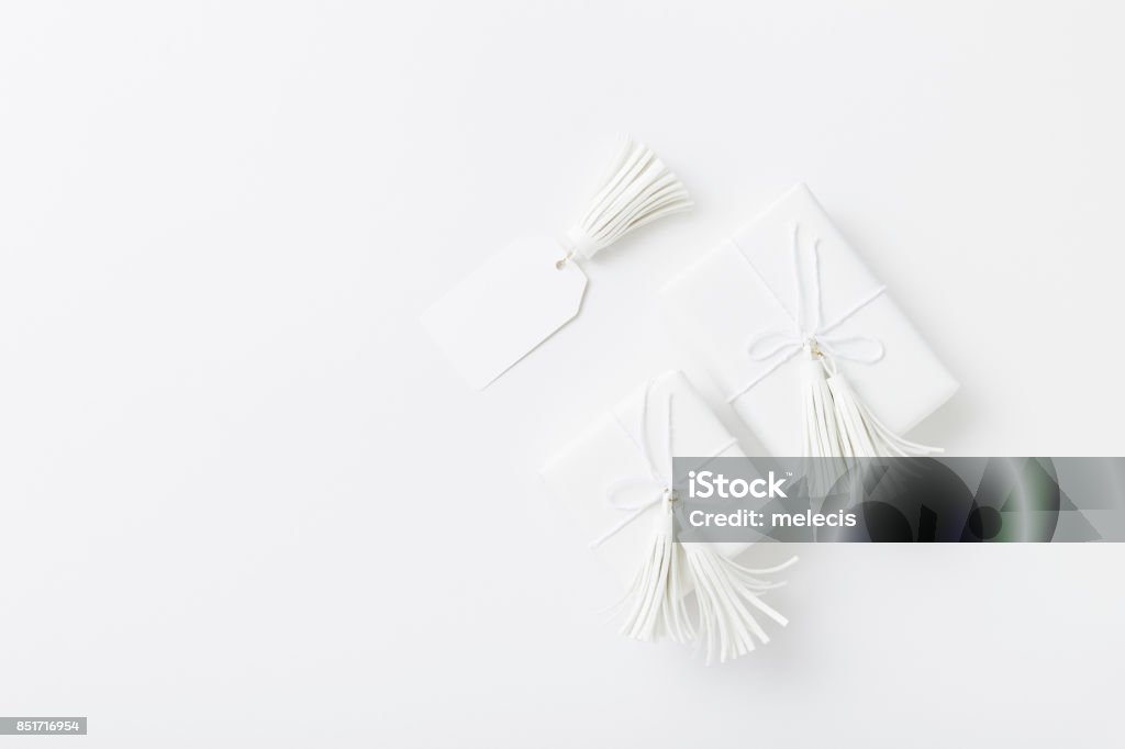 White Christmas Gifts on white background, clean layout Holiday - Event, Christmas, Christmas Decoration, Christmas Present, flat lay, White color, White Color Stock Photo