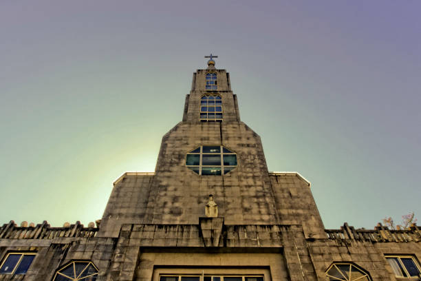 Low angle view of church and tower in sunlight