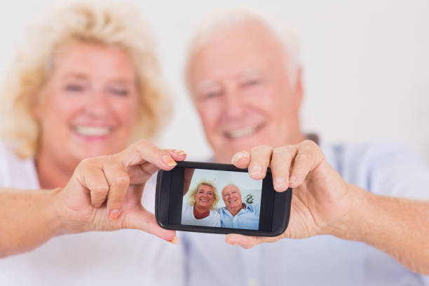 istock Old couple taking pictures with a smartphone 851721132