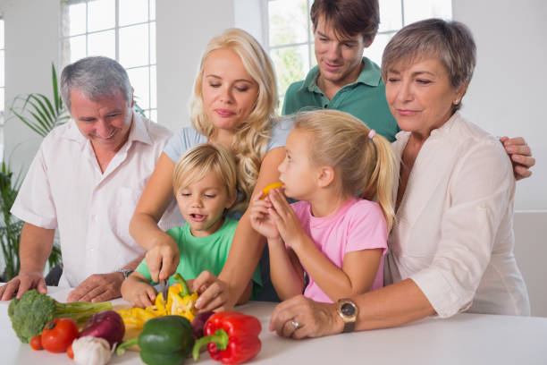 istock Mother chopping peppers for family 851757790