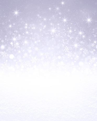Falling snowflakes, white snow and bright light on a glittering silver colored background
