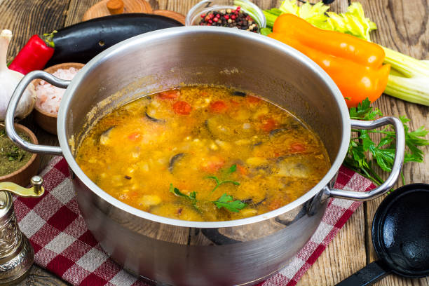 istock Vegetarian vegetable soup with eggplants and tomatoes in saucepan 851762464
