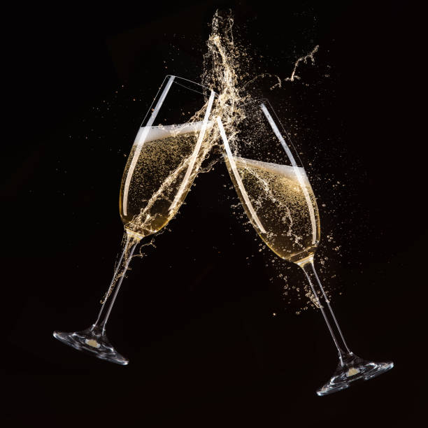 bicchieri di champagne, tema celebrazione - champagne celebration glass black foto e immagini stock