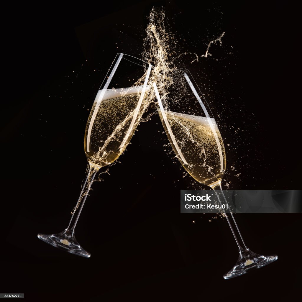 Glasses of champagne, celebration theme Glasses of champagne with splash, celebration theme. Champagne Flute Stock Photo