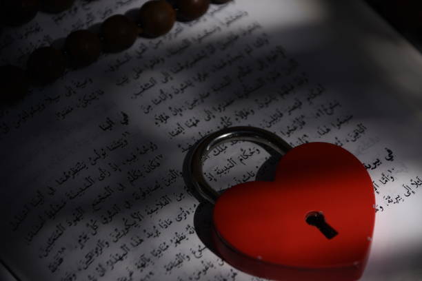 istock An ancient Koran With a heart shaped lock 851766506