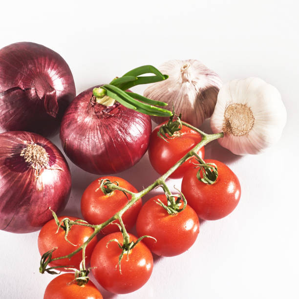 istock blue onion garlic and tomato isolated on white background 851766884