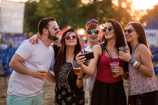 istock Group Of Friends On Walk Taking Selfie In Forest 851770832