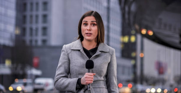 Portrait of newsreader Portrait of newsreader talking on microphone. newsreader stock pictures, royalty-free photos & images