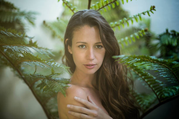 istock Beautiful woman standing outdoors in garden 851774858