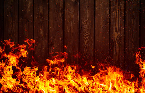 istock Fire flames and wooden boards background 851779130
