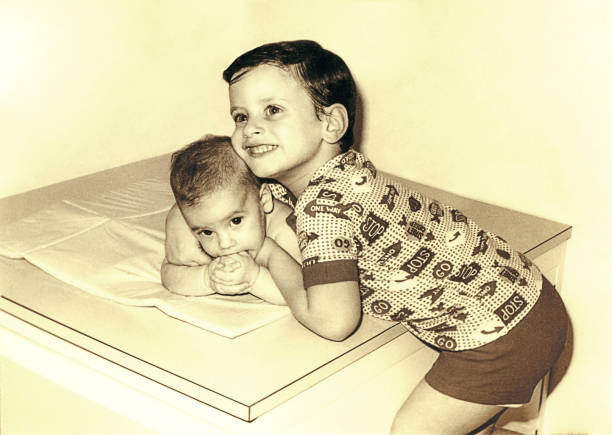 istock Vintage boy hugging his new sister 851779670