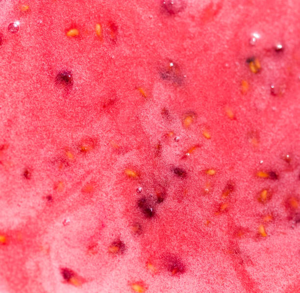 red honey with berries as background