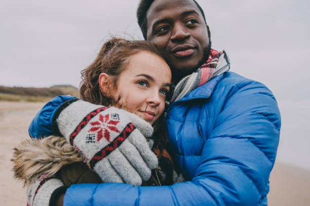 istock Young Couple Hugging On A Winter Beach 851789246
