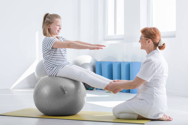 istock Girl sits on grey ball 851793344