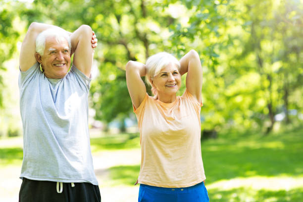 istock Senior Couple Exercising In Park 851793876