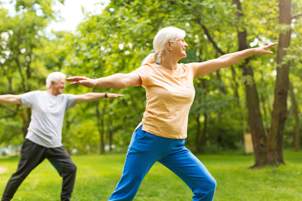 istock Senior Couple Exercising In Park 851794026