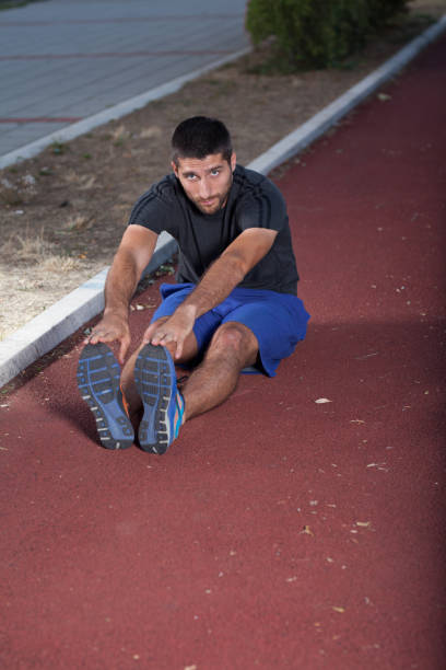 istock The young guy rests on the running track 851794088