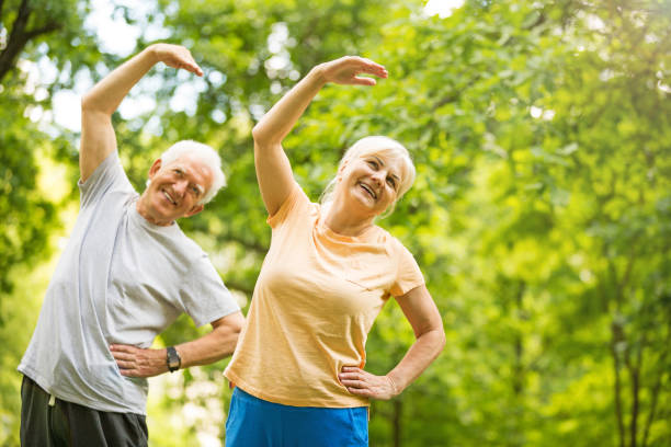 istock Senior Couple Exercising In Park 851794156