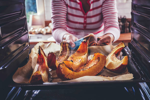 istock Preparing Pumpkins for Roasting in the Oven 851794436