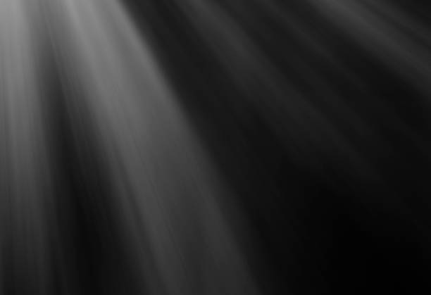 istock Warm sun rays light effects isolated on black background for overlay design 851802206
