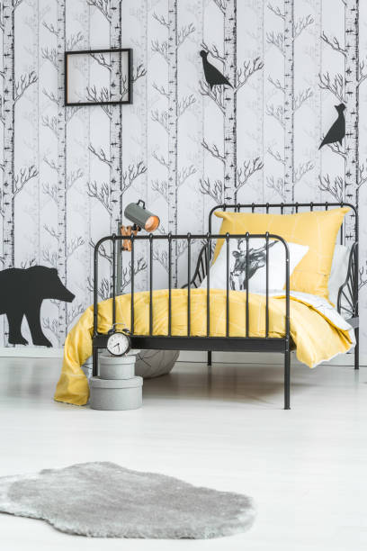 istock Kid's bed with yellow overlay 851806098