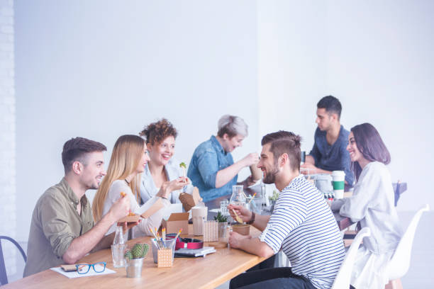 istock Coworkers talking and eating 851806782