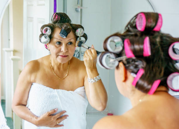 istock Mature hispanic woman wearing hair rollers 851810766