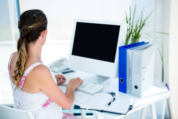 istock pregnant business woman typing on her computer 851811126