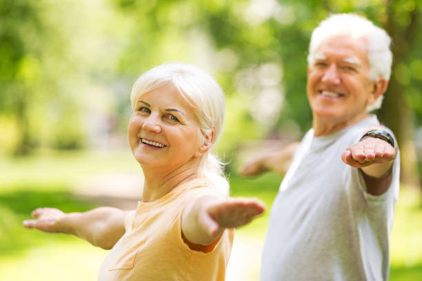 istock Senior Couple Exercising In Park 851813266