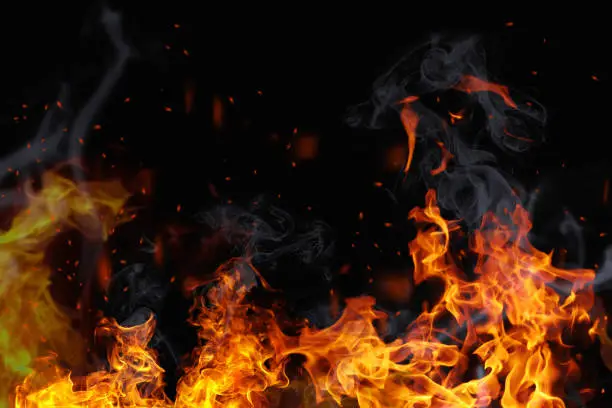 Photo of Texture of fire on a black background.