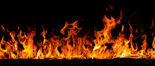 Fire burning on a black background. Ideal for compositing with another image. The background can be removed with a blending mode like screen.