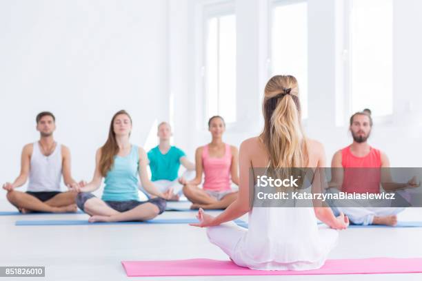 Yoga Instructor In Studio Stock Photo - Download Image Now - Yoga Class, Multi Colored, Exercising