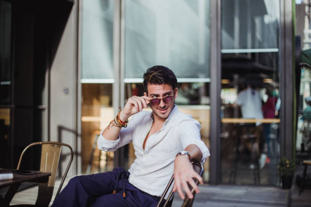 istock Good looking man sitting at the cafe 851843216