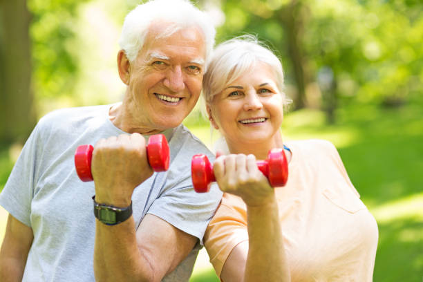 istock Senior Couple Exercising In Park 851846894