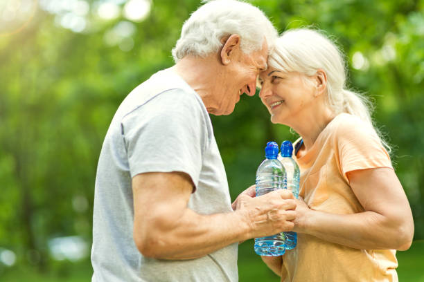 istock Senior Couple Exercising In Park 851847090