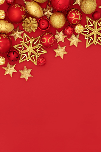 Christmas red and gold bauble decorations forming a background border.