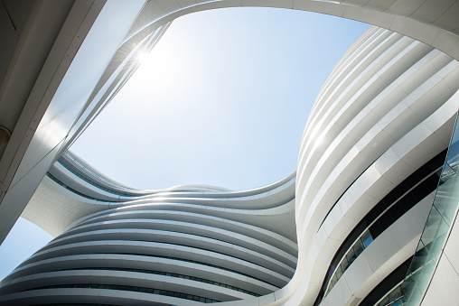 Beijing, China - August 4, 2017: Beautiful modern rounded buildings at the Galaxy Soho, a complex with office buildings, shopping mall, stores and restaurants in Beijing, China. Galaxy Soho was designed by Zaha Hadid architects and opened in 2012.