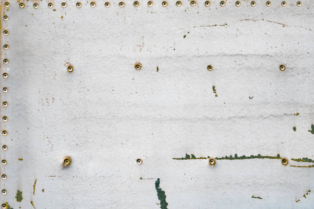 istock Old rusty metal plate with rivets and screws. Background and texture. 851854564
