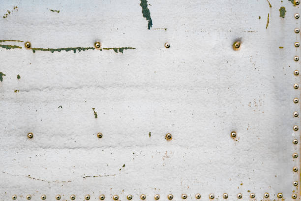 istock Old rusty metal plate with rivets. Background and texture. Vintage backdrop, 851854664