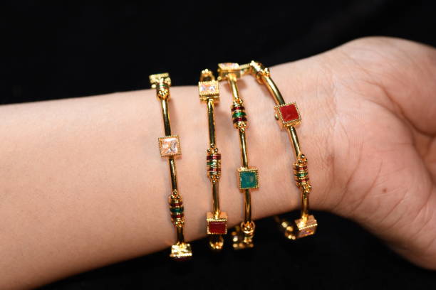istock Fancy gold looking imitation bangles / bracelets on the woman's wrist 851856086