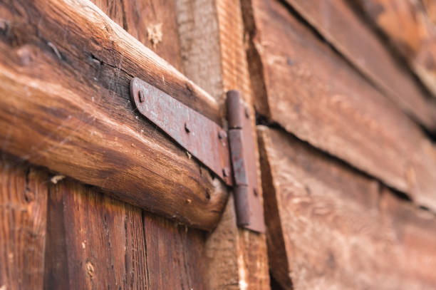 Close-up of a rusty canopy on an old wooden door in a small village