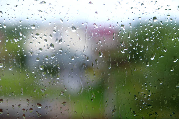istock Rain drops on window glass on autumn day closeup 851859840