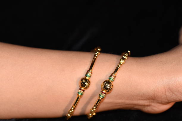 istock Fancy gold looking imitation bangles / bracelets on the woman's wrist 851860004