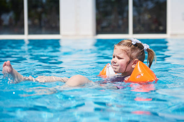 istock Girl swimming in the pool 851863306